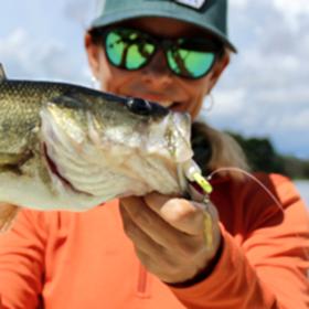 Woman holding largemouth bass