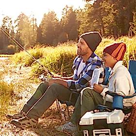 Man and child fishing at river lake