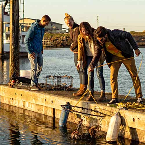man and woman catching crab