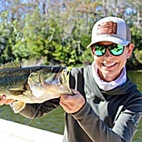 Woman holding largemouth bass