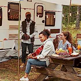 Group of people enjoying an RV picnic